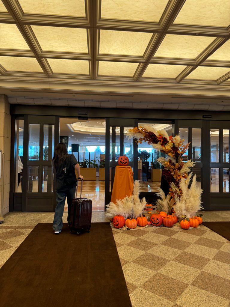 Hotel lobby entrance decorated with pumpkins and pampas grass for autumn