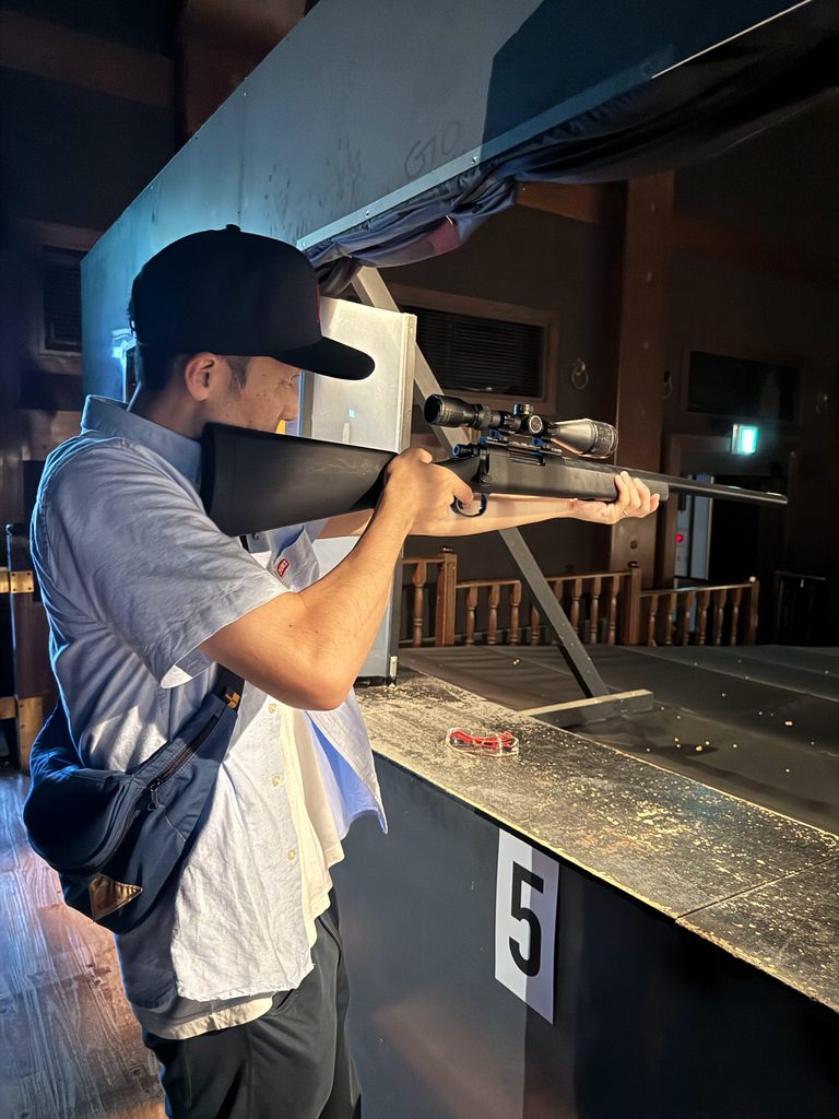 Taking aim with a rifle-style controller at the Huis Ten Bosch shooting attraction