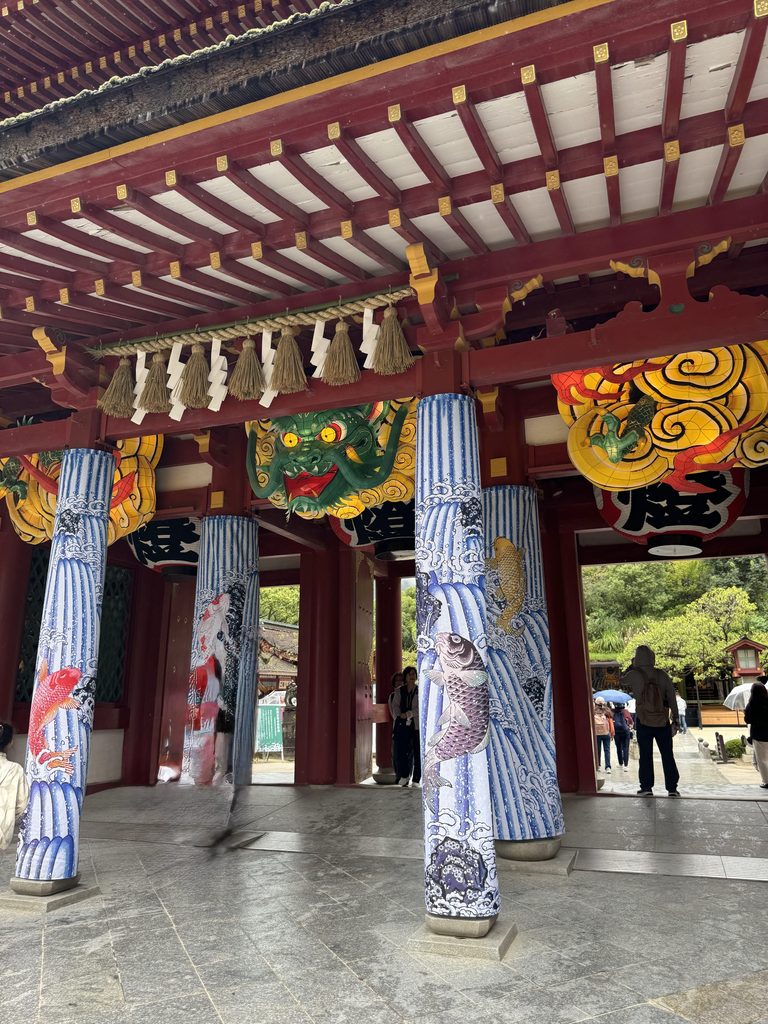 The ornate vermilion romon gate of Dazaifu Tenmangu with its painted pillars