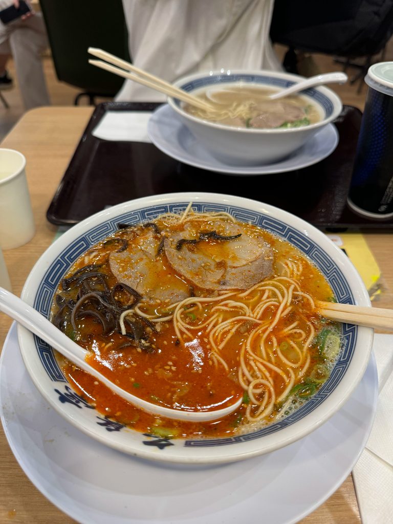 A steaming bowl of Hakata ramen with chashu pork and thin noodles