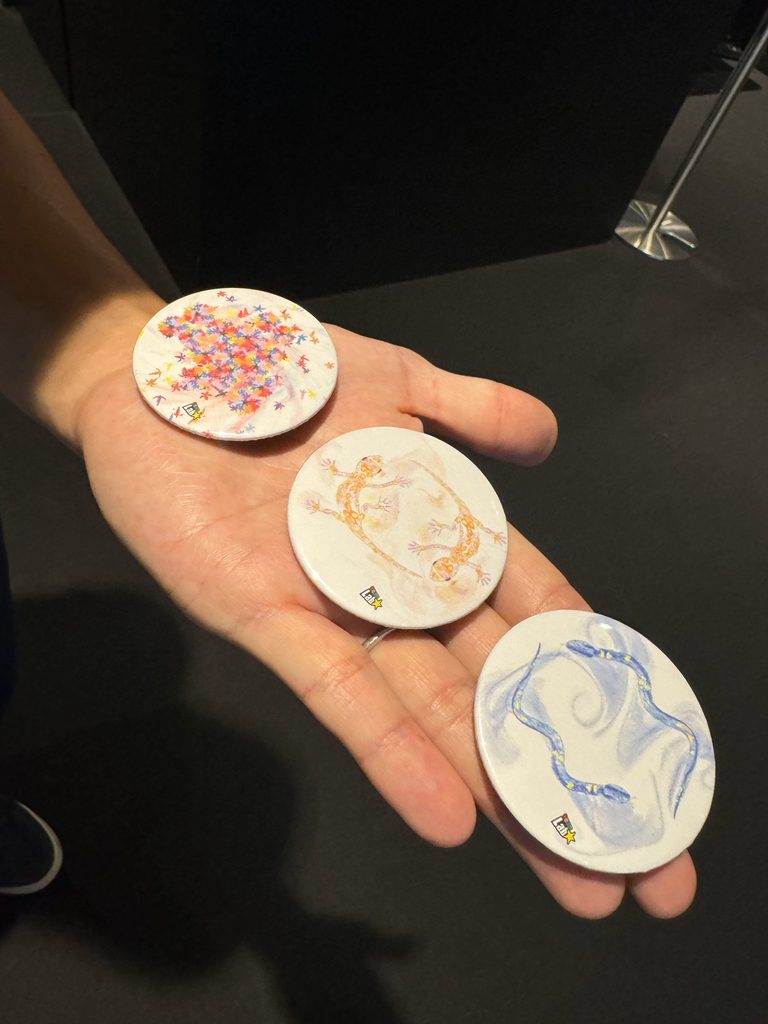 Three hand-made can badges created at the teamLab museum
