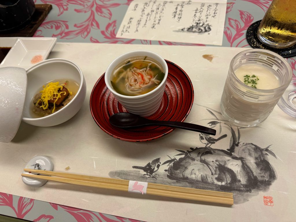 Chawanmushi, small side dishes and the handwritten menu at the ryokan dinner in Yufuin
