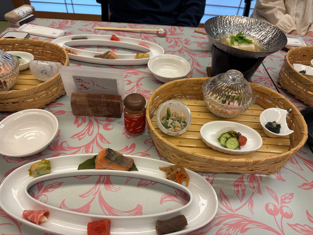 Breakfast at the ryokan in Yufuin with grilled salmon and many small side dishes